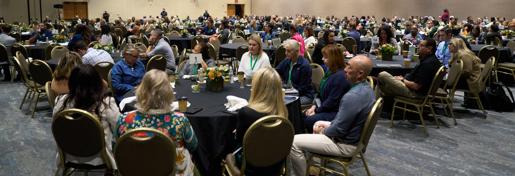 Engaged audience in a large convention room